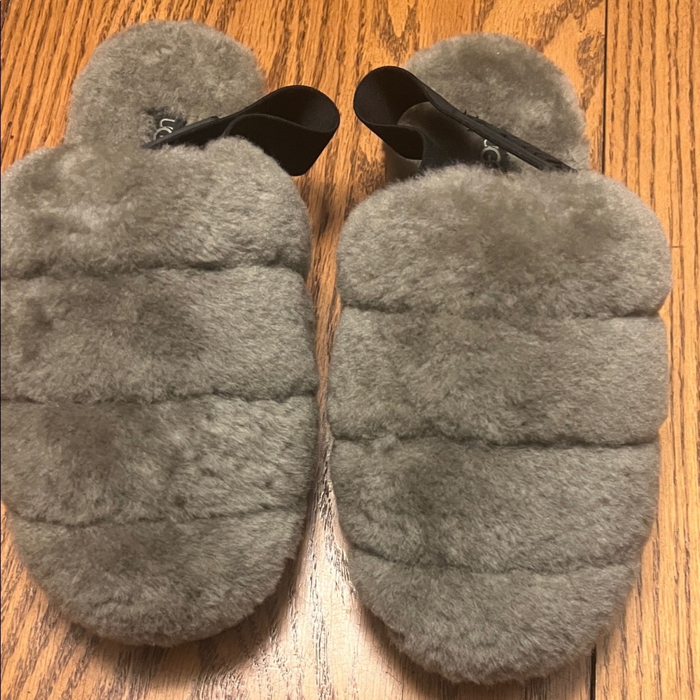 UGG women’s super fluff shearling slippers Charcoal in color